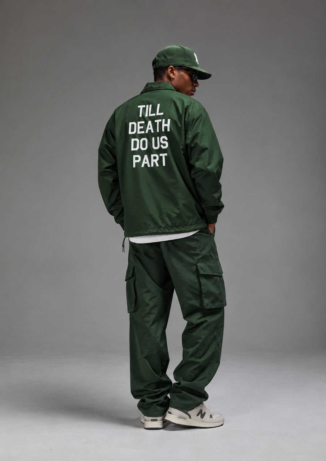 Man wearing green Till Death Do Us Part Skull Mens Coaches Jacket