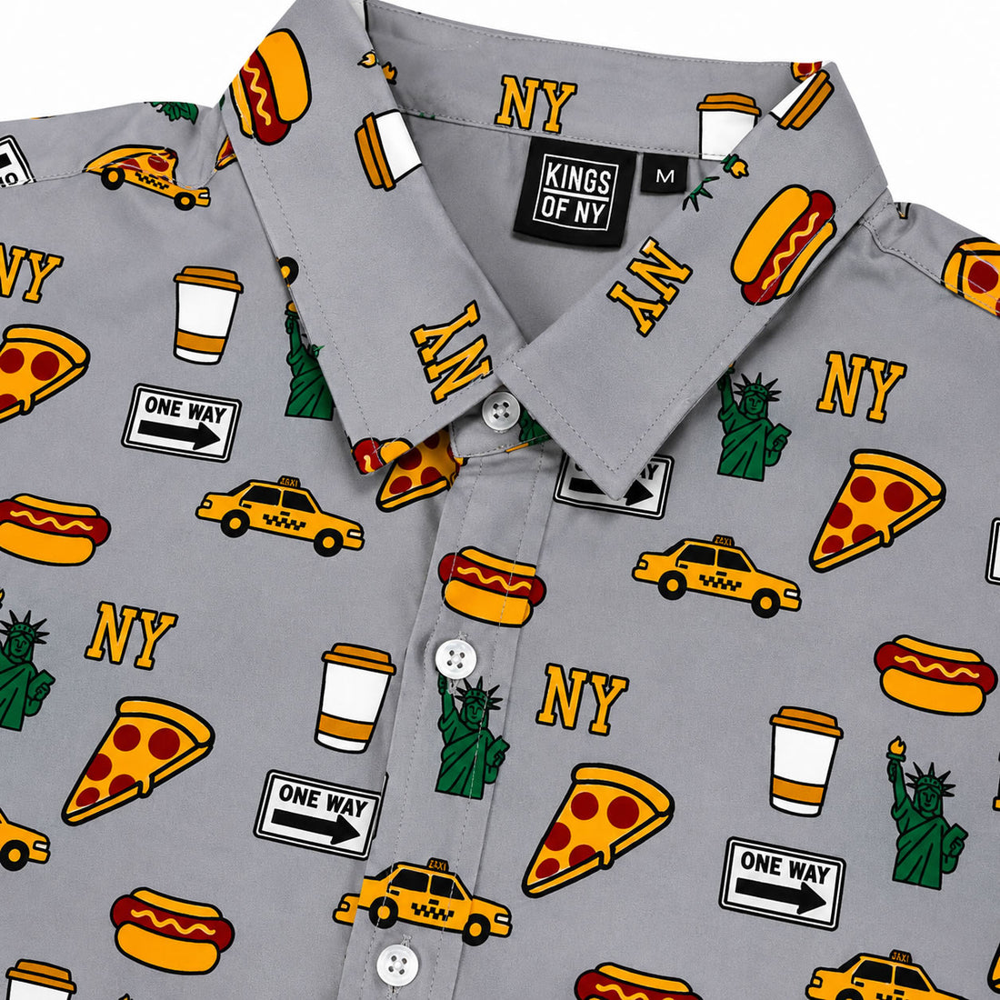 Gray shirt with New York-themed pattern including hot dogs, pizza slices, taxis, and the Statue of Liberty.
