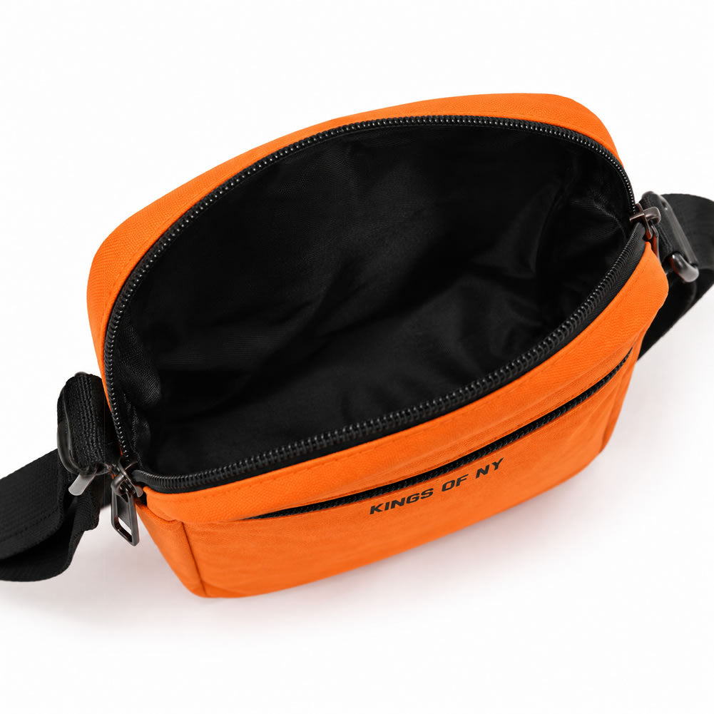 Bright orange crossbody bag with a black interior, black zipper, and black strap, featuring the text 'KINGS OF NY' printed on the front, shown on a white background.
