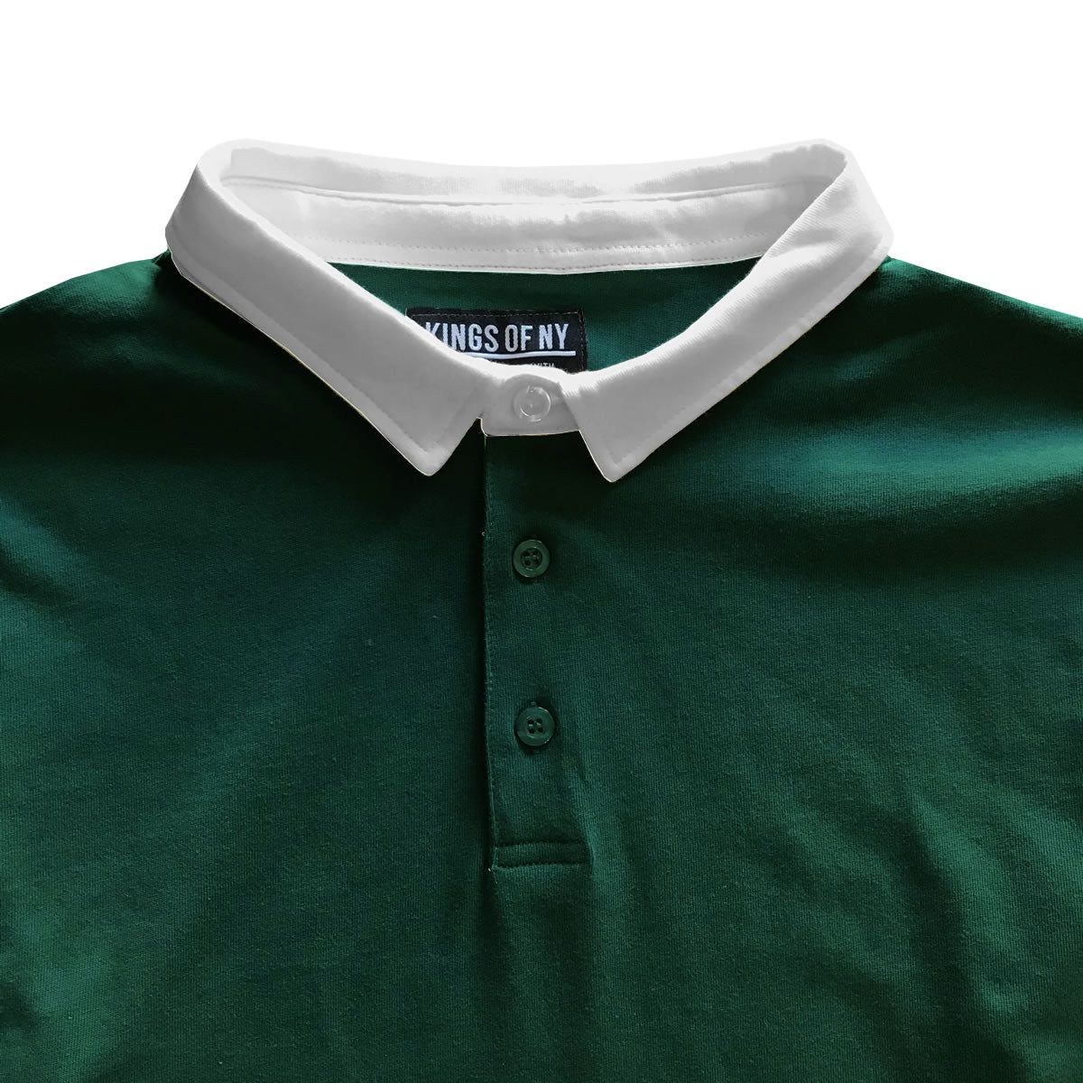 White polo outlet with green collar